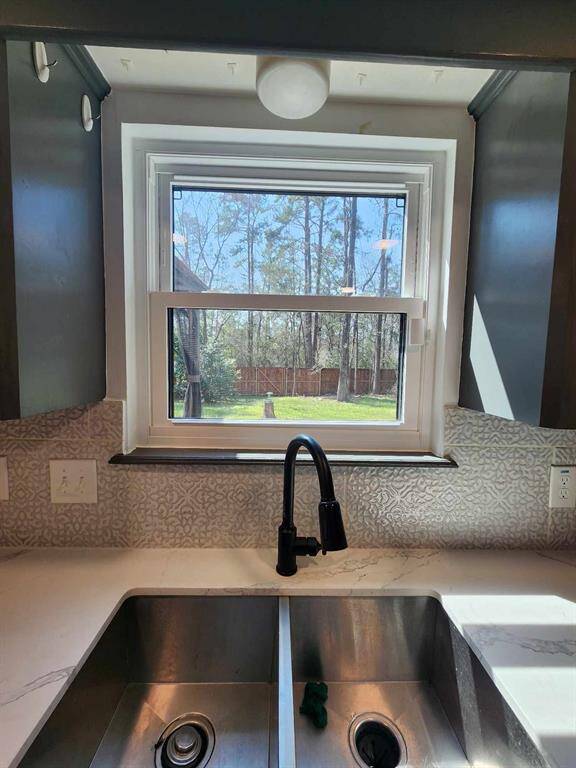 Window over sink to gaze out into the backyard