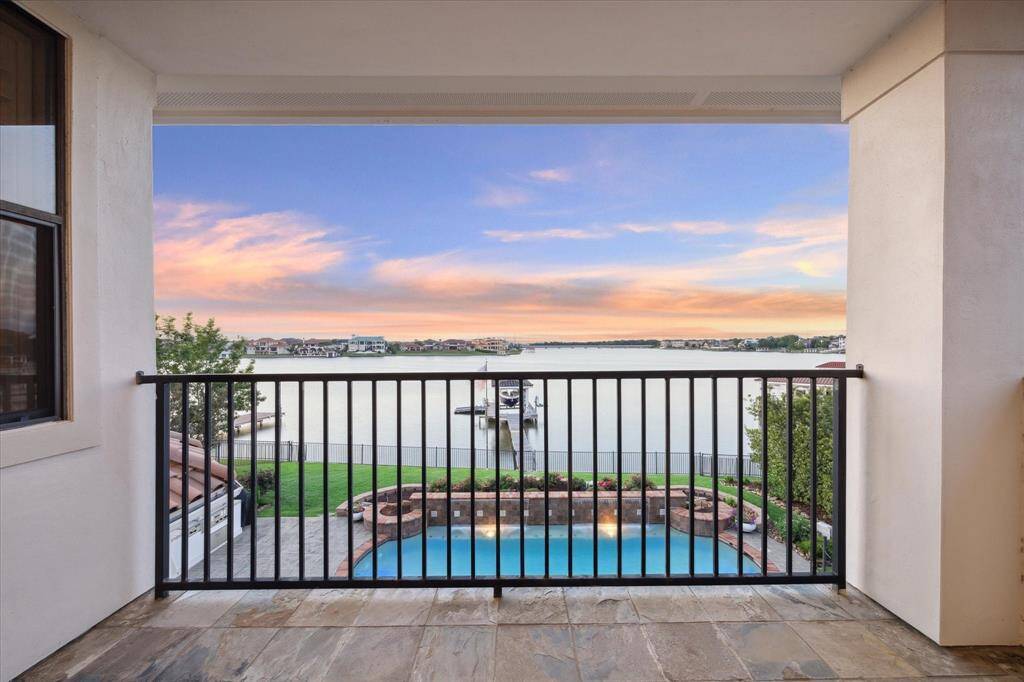LAKEFRONT BALCONY OFF OF THE GAMEROOM AND SECOND BEDROOM.