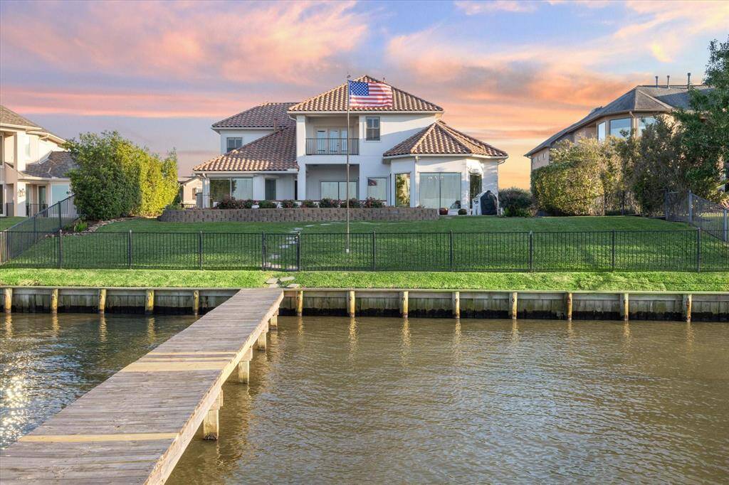 THE MEDITERRANEAN ARCHITECTURE CREATES A BEAUTIFUL VIEW FROM THE BOATHOUSE.