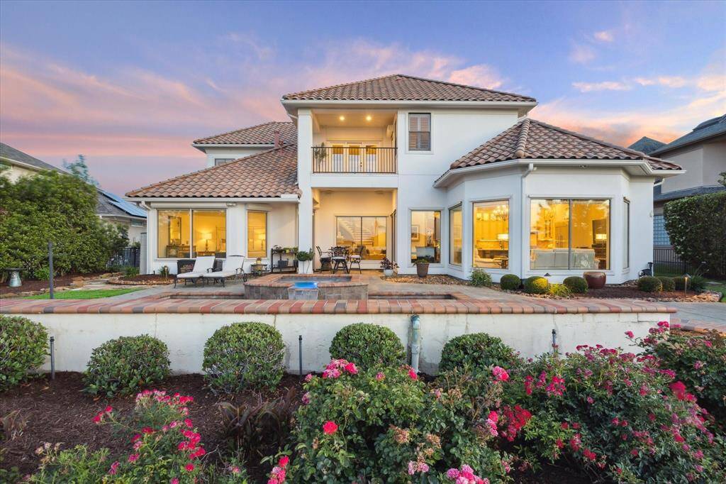VIEW FROM THE POOL HIGHLIGHTS THE BALCONY AND EXPANDED PATIO FOR OUTDOOR ENTERTAINING.