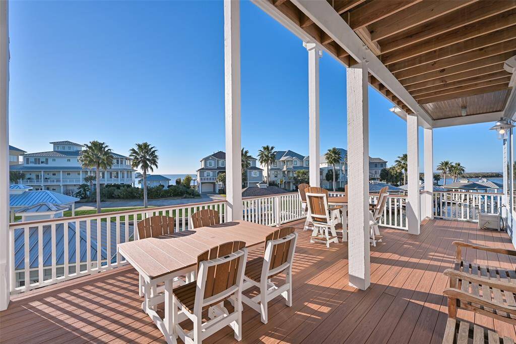 Main level deck with plenty of seating and gorgeous water views