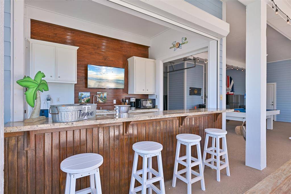 Outdoor kitchen with bar seating