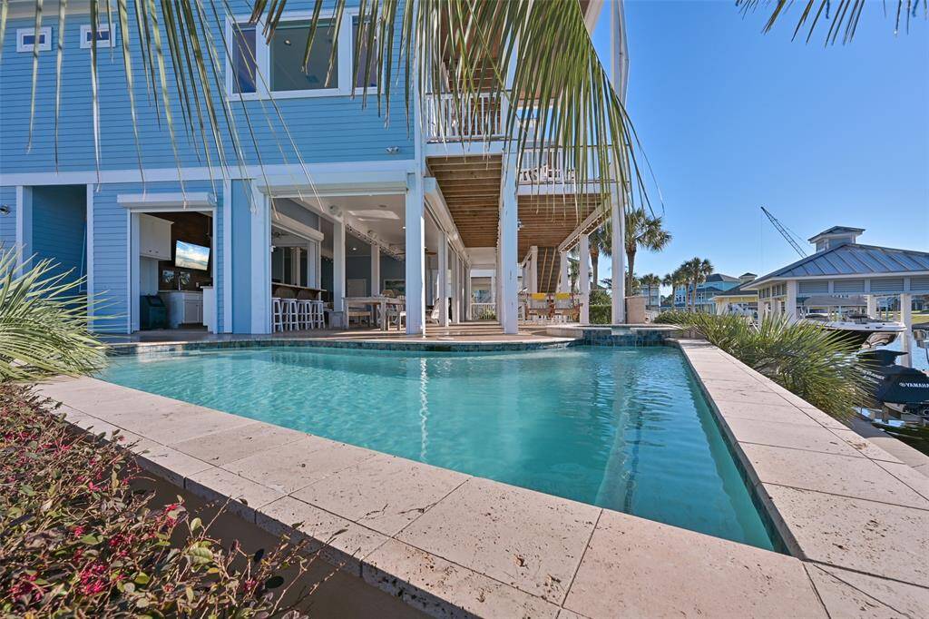 Swimming pool with attached hot tub