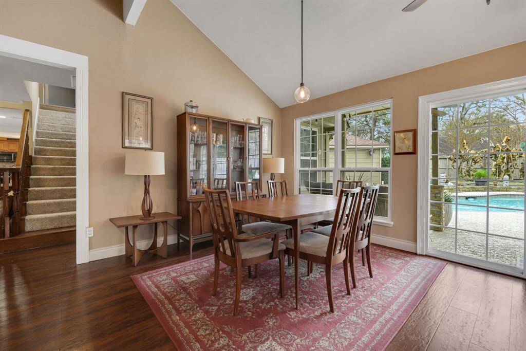 Living room is also being used as a dining room to enjoy the gorgeous view of the pool.