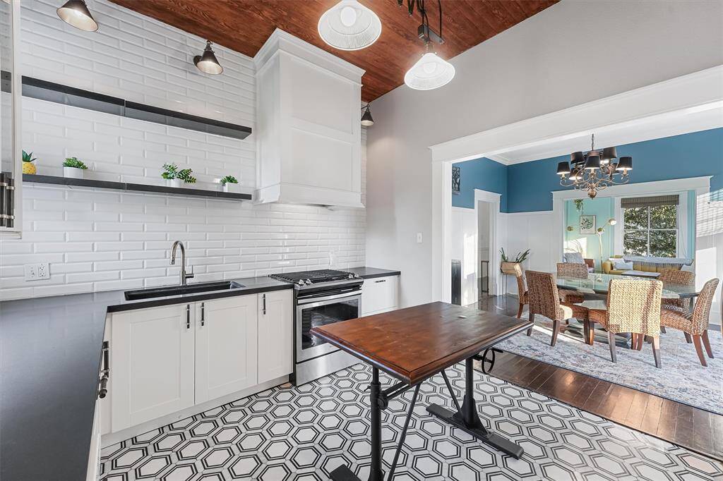 The kitchen flows into the formal dining allowing open concept living throughout the home
