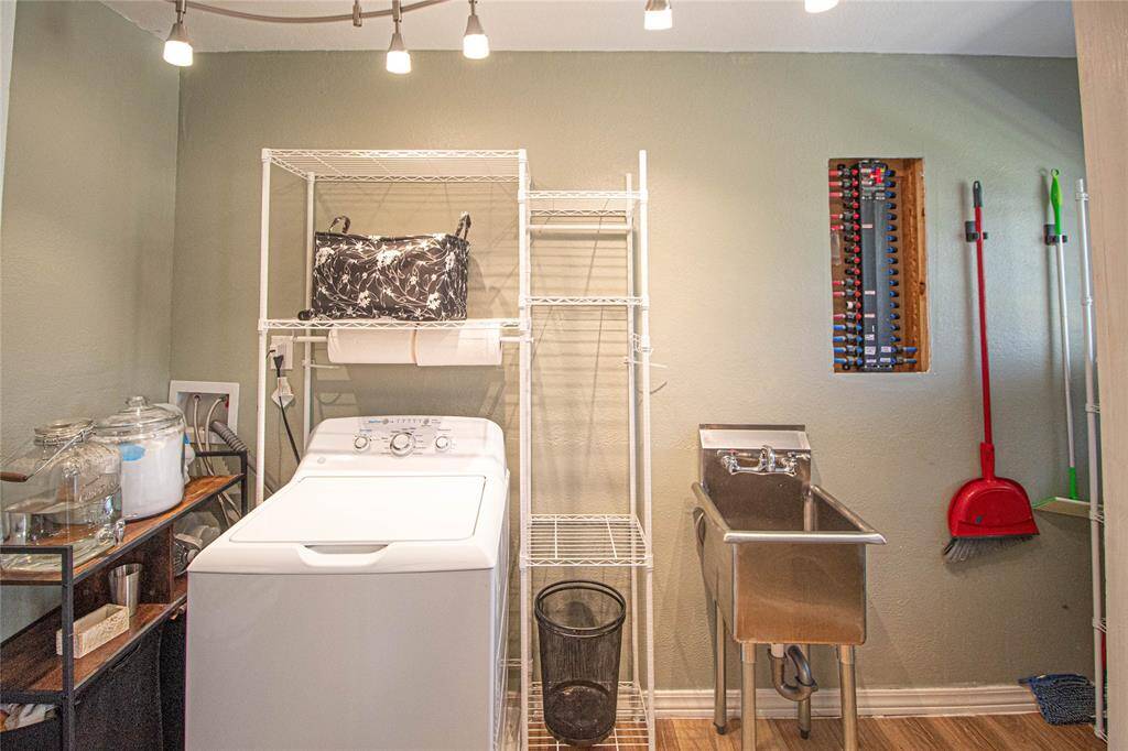 Home features a spacious laundry area, tankless water heater just off the kitchen.