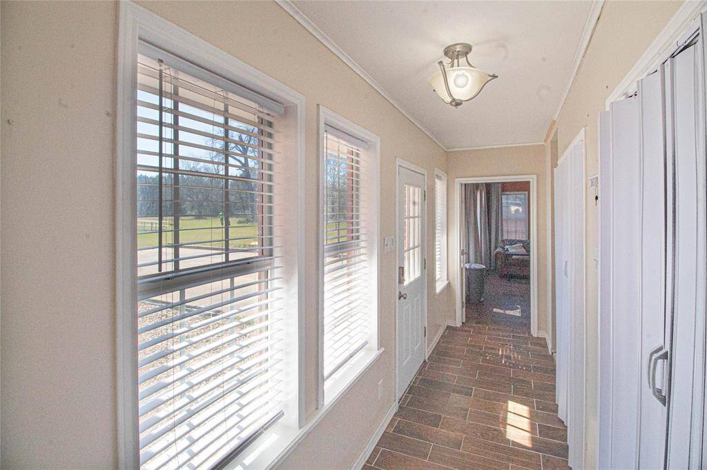 This hallway leads from the family area to the master suite and has a great deal of storage