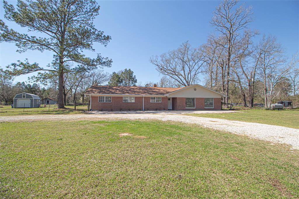 The home sits back off the highway and features a circle drive with plenty of parking.