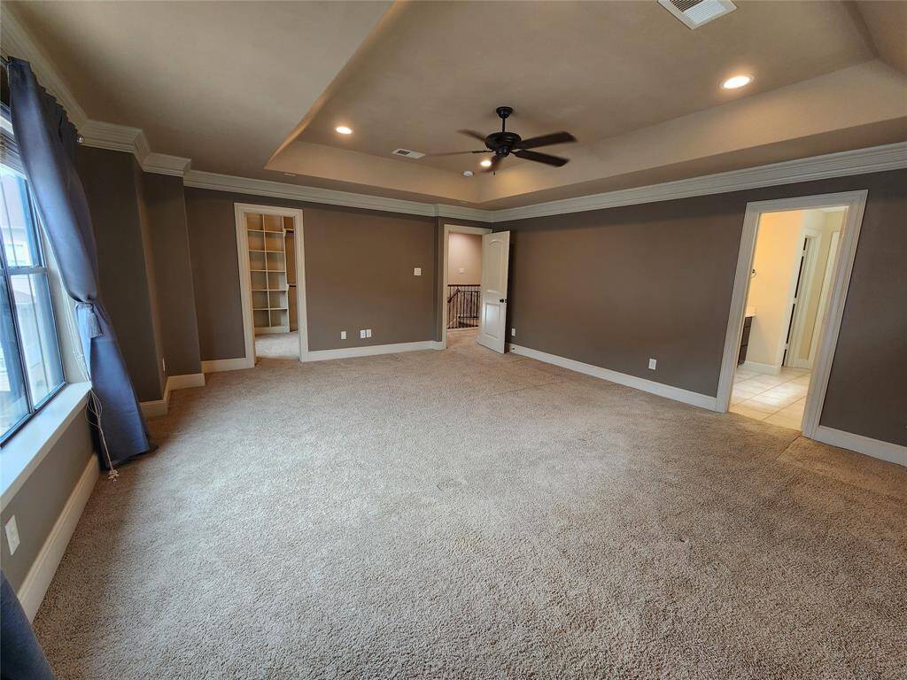 Primary bedroom with him and hers walk in closets