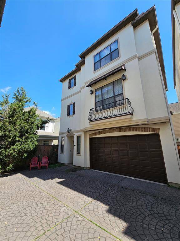 Spaceous Mediterranean-style home with lots of garage space. Gated Entry to lovely community.