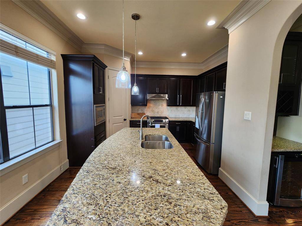 Granite counterop with lots of counter space for preparing delicous meals. The butlers pantry is off to the right.