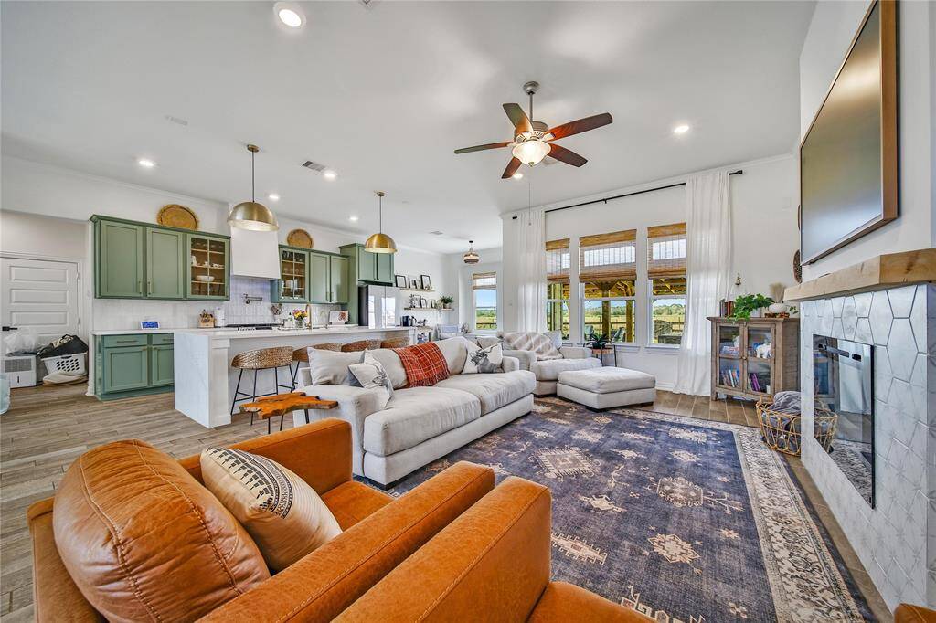 When you enter the front door, the living room and kitchen are to the right.