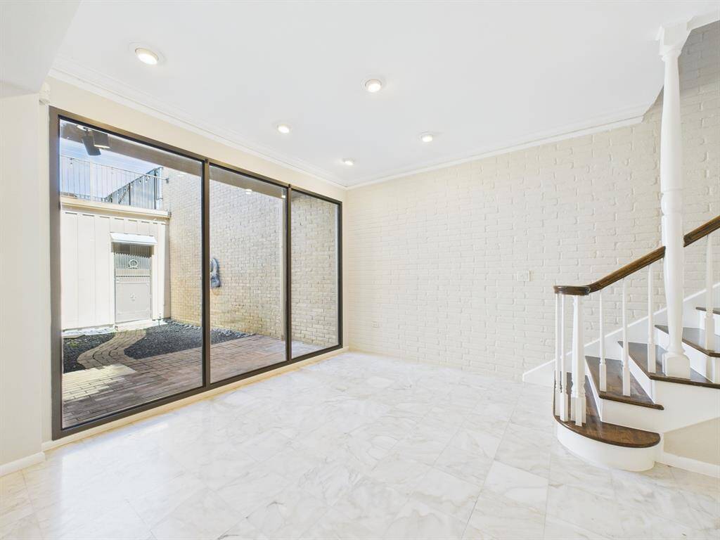 Bottom of the stairs is a perfect seating area for morning coffee and view of the atrium