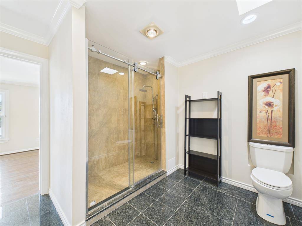Stand Alone Tiled Shower and Marble Flooring