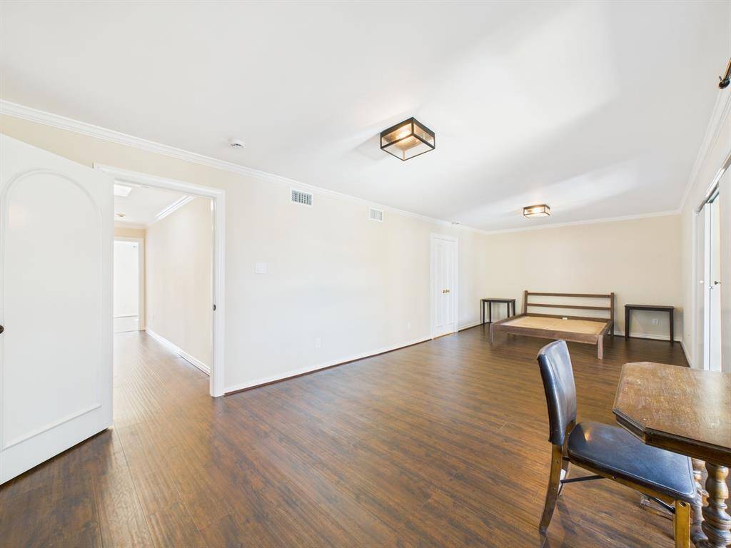 Split Plan; Hallway leads to second floor primary