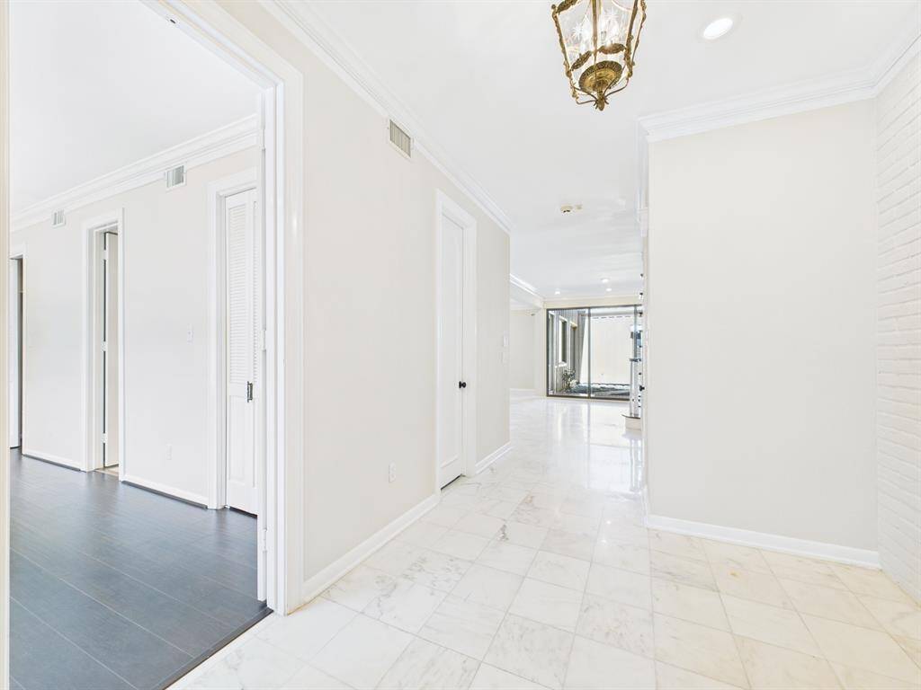 Off the Formal Entry is the Downstairs Primary and a Half Bath