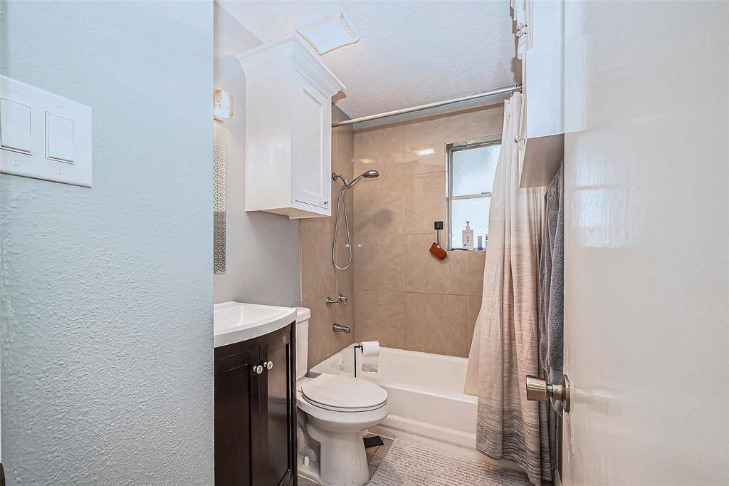 Adjacent view of bathroom.
