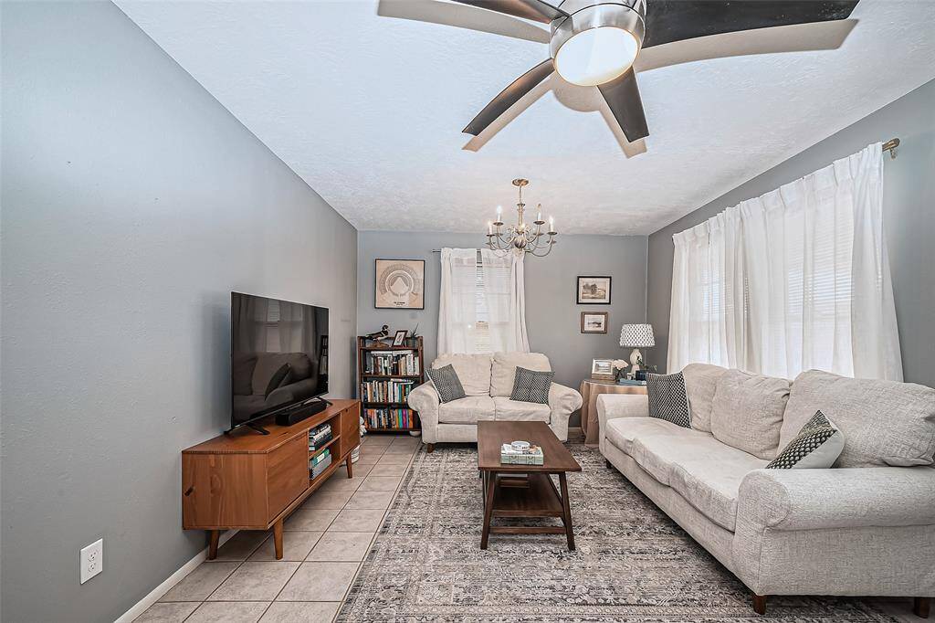 Adjacent view of living room area.