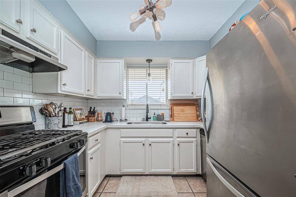 Recently updated kitchen with stainless appliances and gas cooktop.