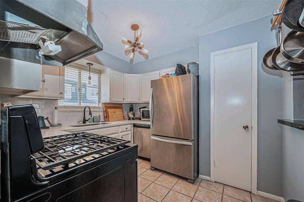 Adjacent view of kitchen with pantry.
