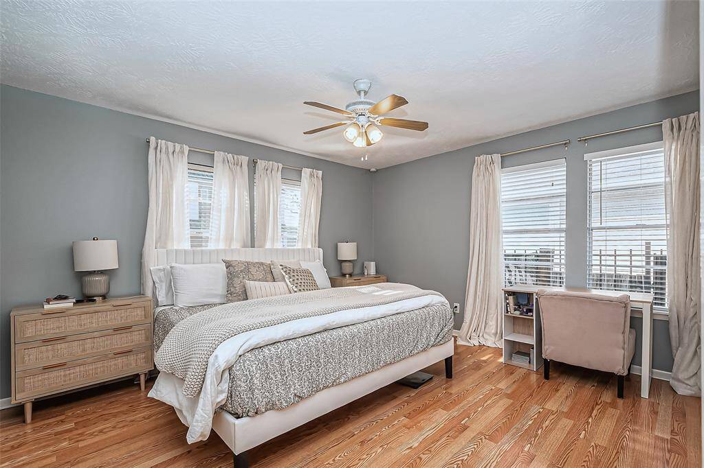 View of primary bedroom showcasing amble amount of space bedroom furnature.