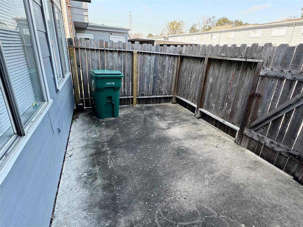 Back patio with gate to parking
