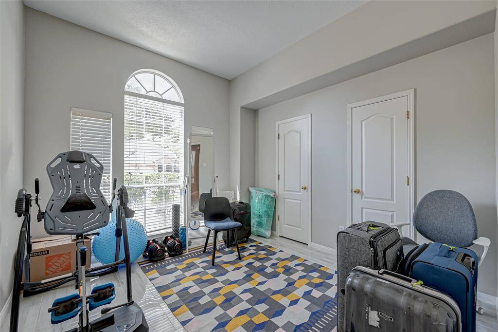 Secondary Bedroom is Highlighted by Beautiful Tile Floors.