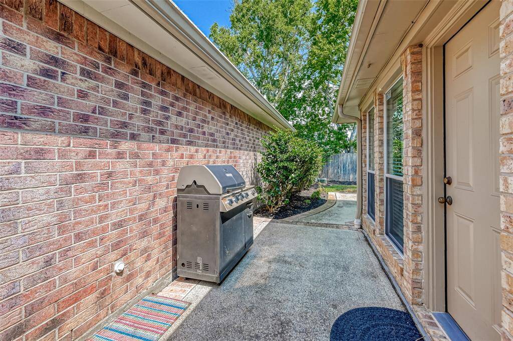 Another View of side of home by back door; Grill not included.