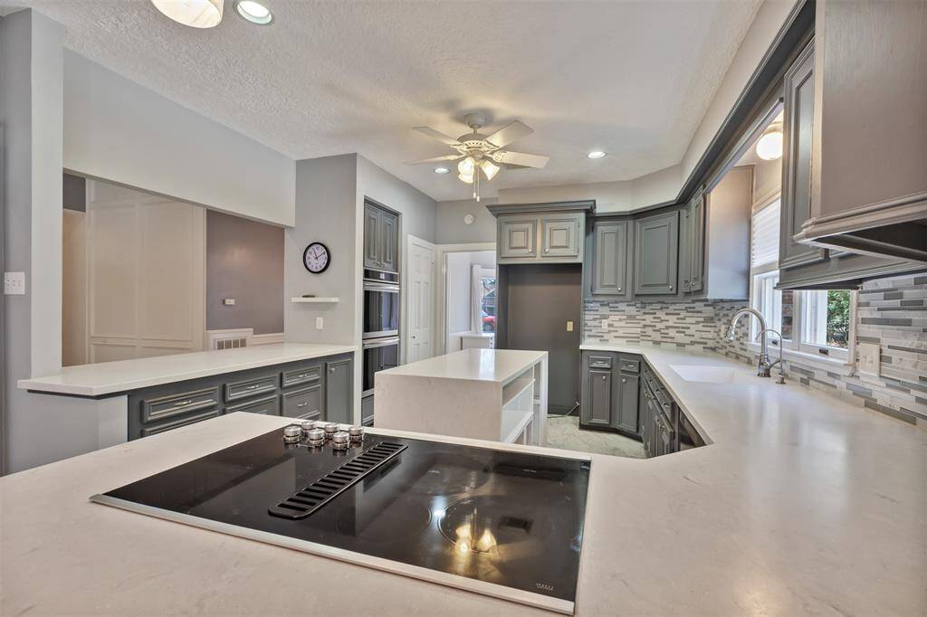 Another view - the kitchen island is not attached and is easily removed.  Although there are plenty of cabinets and ample countertop space, the island offers additional storage, if needed.