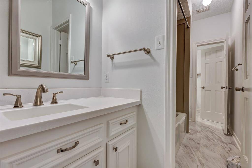 Bath 2 is a Hollywood style to serve the secondary bedrooms.