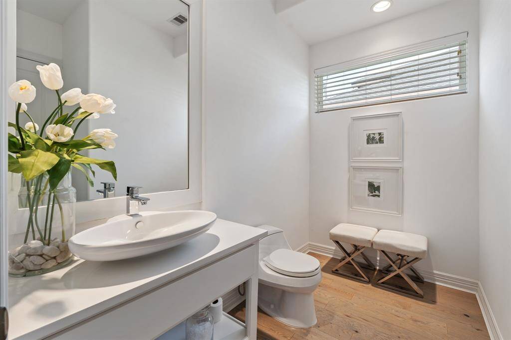 Conveniently situated near the versatile Dojo room, this stylish half bath offers easy access and modern comfort.
