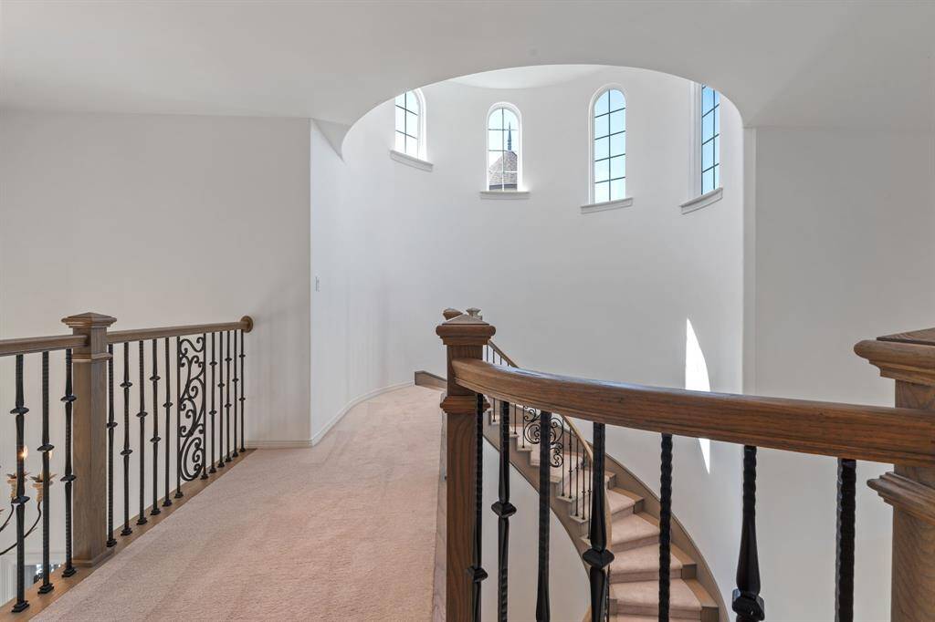 Elegant staircase ascending to the upper level.