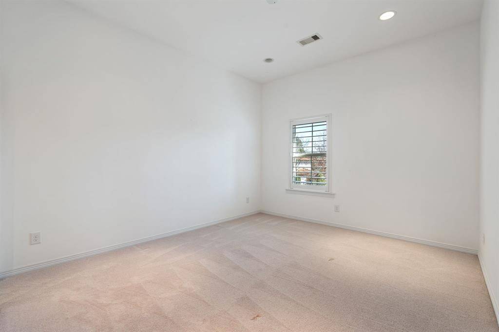 This secondary bedroom is located upstairs.
