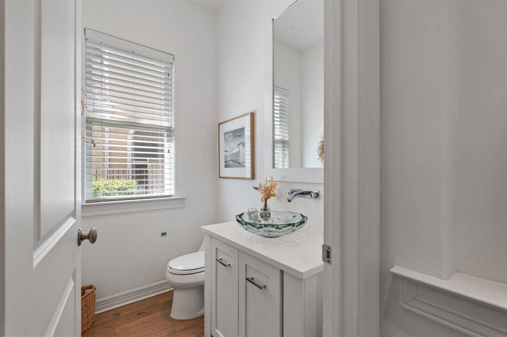 This half bath is located off the foyer for easy access when you have guests over, or are entertaining.