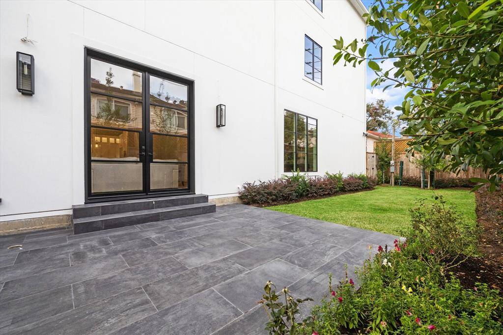 Handsome slate gray tiles cover the steps as well as the sizable Patio.