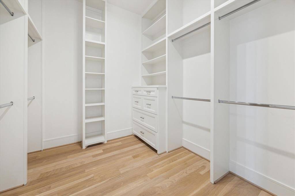 The second of the dual Master Closets is equally large, with varying modes of storage and flexibility.