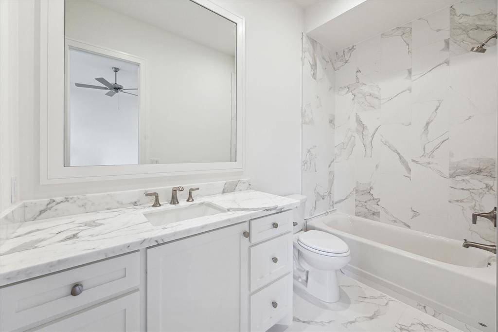 The secondary Baths are nearly as luxurious as the Master Bath featuring marble counters, framed mirrors and custom Vanities.