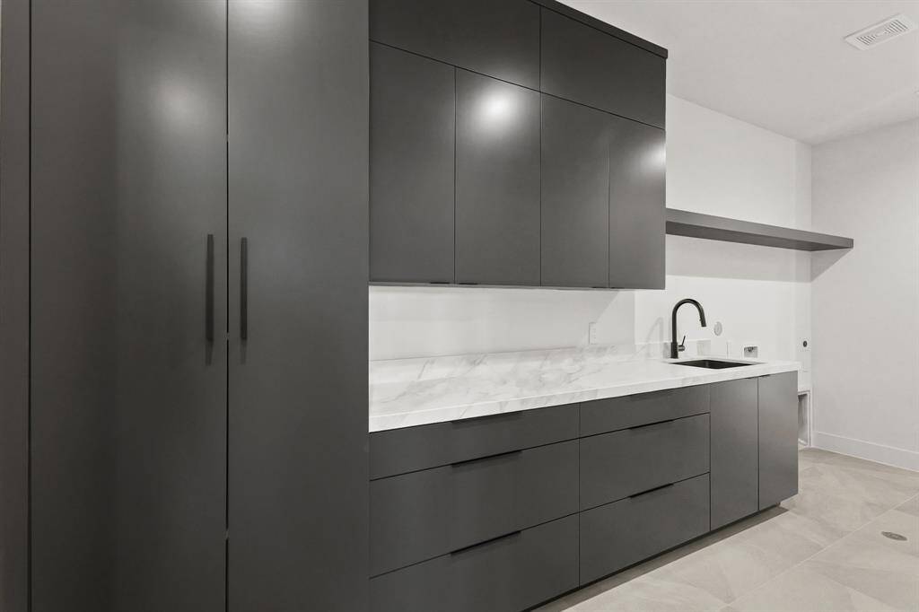 Laundry Room off the Primary Closet. - Echo Custom Homes