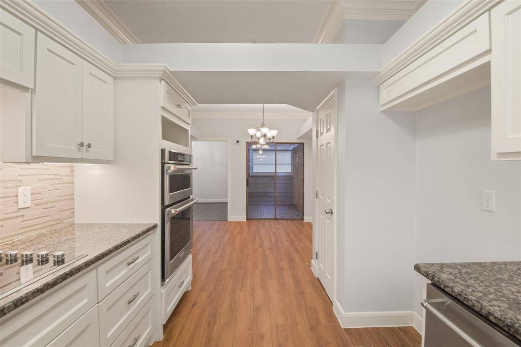 Another view of the kitchen seamlessly connecting to the breakfast area.