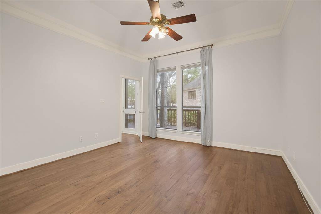 The perspective of the primary bedroom on the first floor without virtual staging.