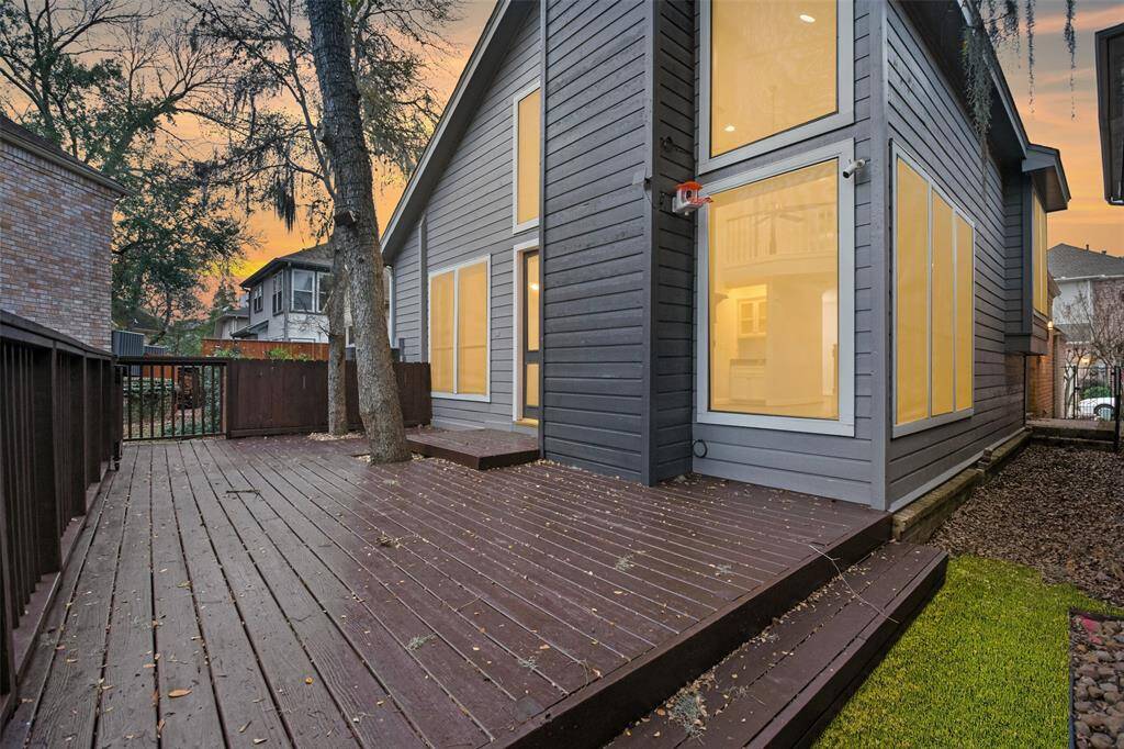 The expansive outdoor deck offers the perfect setting for gatherings, entertaining, or simply enjoying peaceful moments of relaxation.