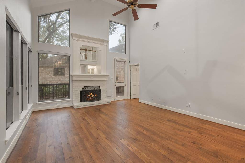 View of the spacious two-story living room without virtual staging.