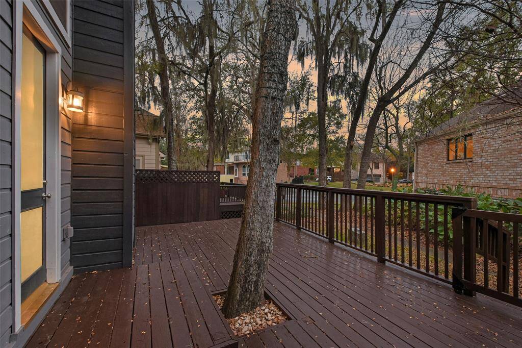 Another perspective of the outdoor deck, offering a stunning glimpse of the tranquil community lake. This is a perfect space for soaking in the beauty of nature, making it a true sanctuary for peace and quiet.