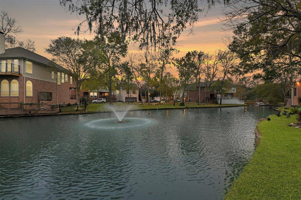 Another serene glimpse of the peaceful community lake and the fountain capturing the essence of relaxation.