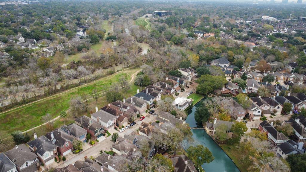An aerial view of the community highlighting its seamless integration with nature, showcasing the proximity and convenient access to the renowned Terry Hershey hike and bike trail.