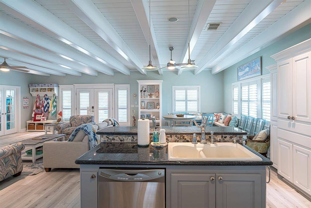 Open concept kitchen, living, and dining areas