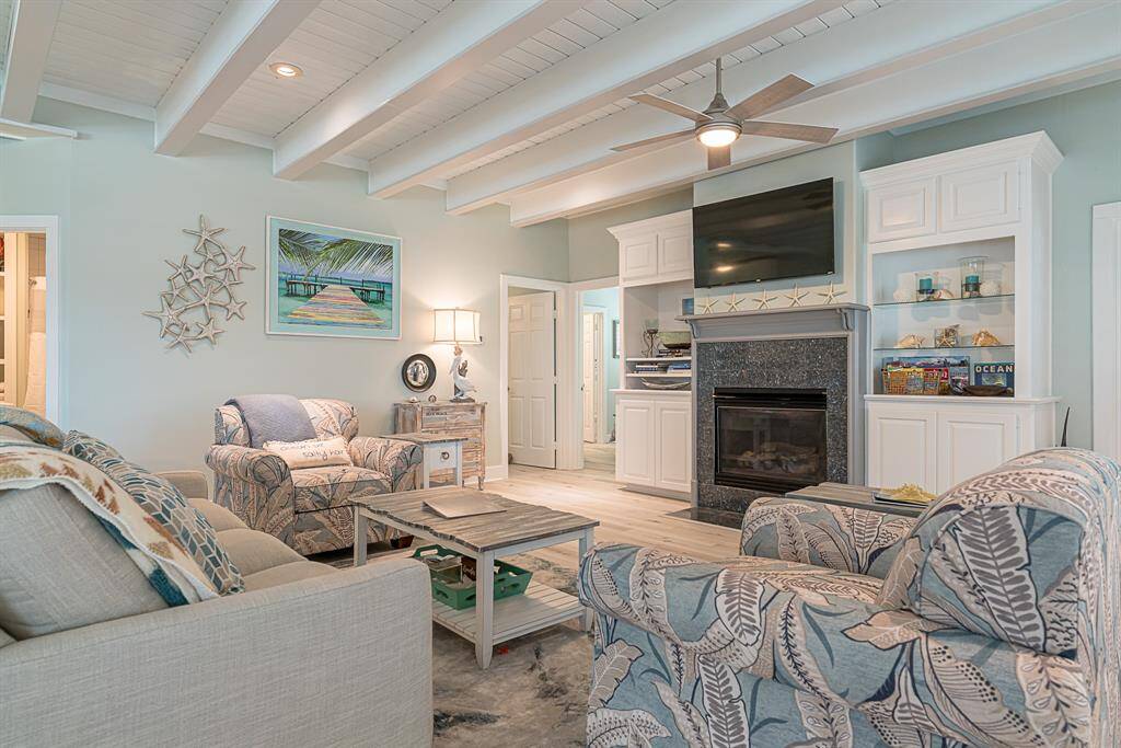 Living area with fireplace and large TV