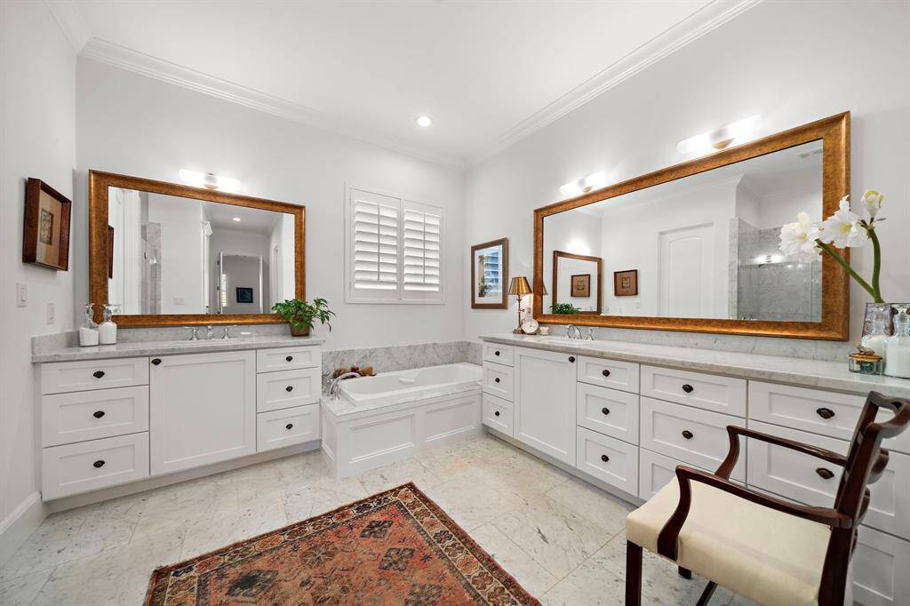 First Floor Primary suite is a true retreat, featuring beautiful hardwood floors and the tray ceiling adds architectural interest. This spacious room offers a perfect blend of comfort and elegance.
