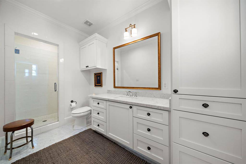 Large guest bedroom with en-suite bath and walk-in closet.