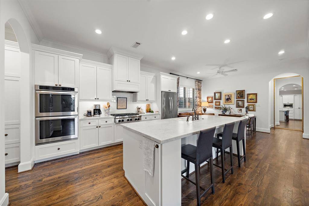 Wonderful open floor plan effortlessly connects the dining, living, and kitchen area creating an ideal flow for both everyday living and entertaining.